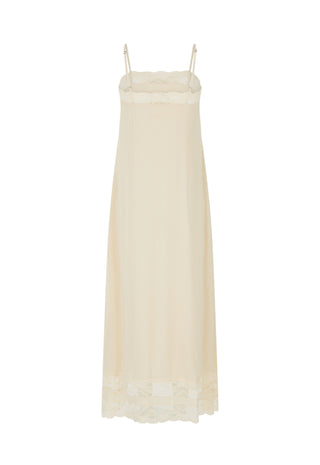 An off-white maxi slip dress with thin straps, a ruffled lace-trimmed bodice, and a matching lace hem, shown against a plain white background.