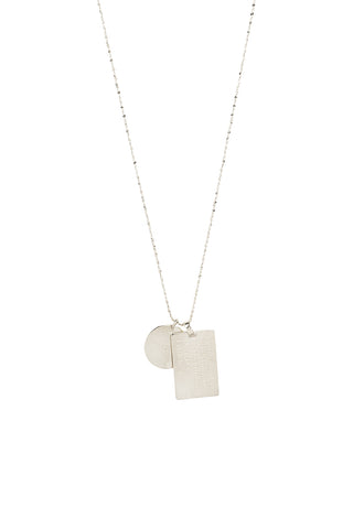 Back view of Spell’s Leo Stargazer Zodiac Necklace. The double embossed pendant charm necklace comes in 0.925 Sterling Silver and hangs from a twisted rope chain.